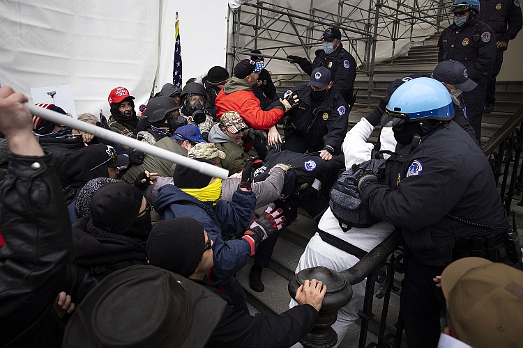 Rioters clash with police at the Capitol on January 6, 2021.